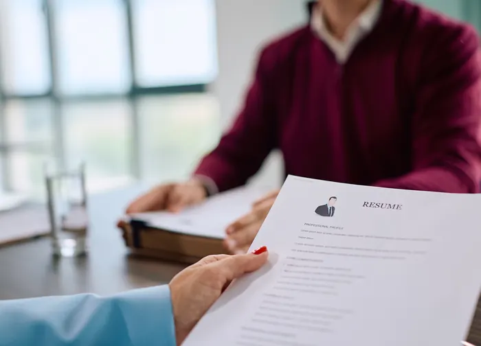 Recruiter reviewing a candidate's resume during an interview